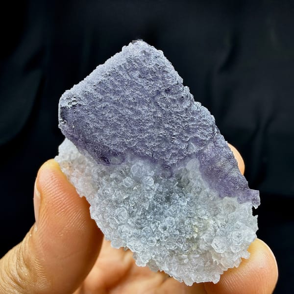 Frosted purple fluorite cube on sparkling white quartz from Fujian, China, detail of the matrix contact