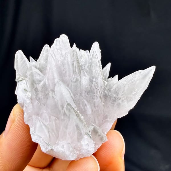 Pale pink feather-calcite crown of pointed blades from Hunan, China, reverse side