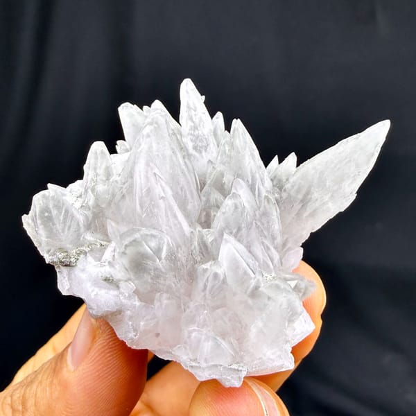 Pale pink feather-calcite crown of pointed blades from Hunan, China, top view