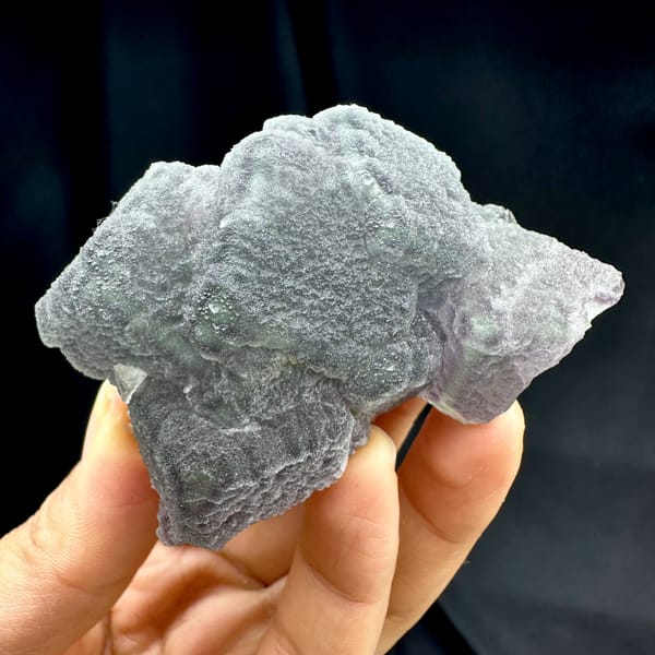 Frosted purple and green fluorite mass with matte skin from Fujian, China, second angle