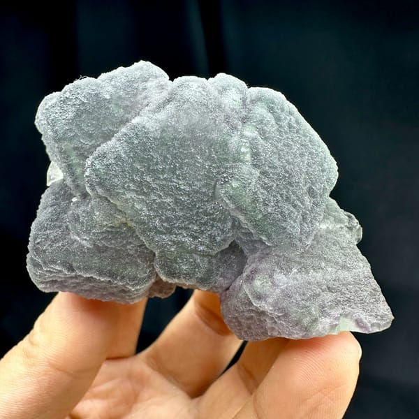 Frosted purple and green fluorite mass with matte skin from Fujian, China, reverse side