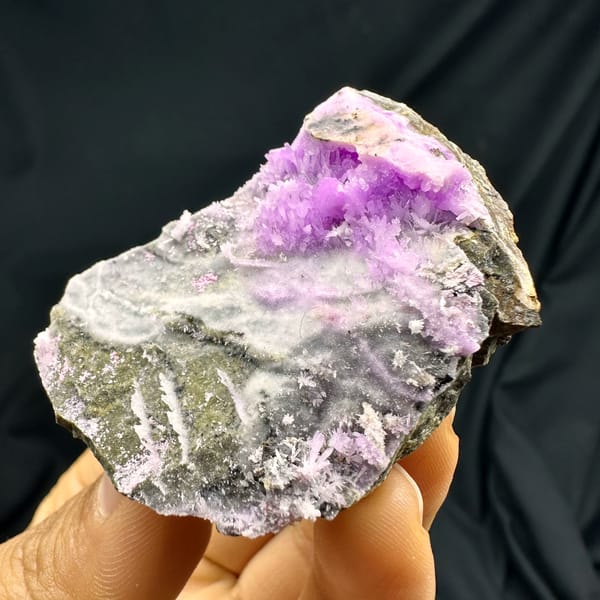 Magenta aragonite patch on pale grey matrix from Yunnan, China, second angle