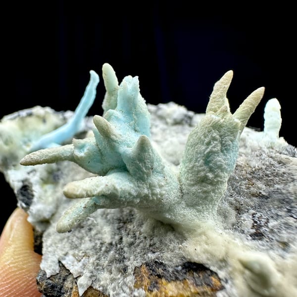 Blue-green stalactitic aragonite fingers on grey rock from Yunnan, China, second angle
