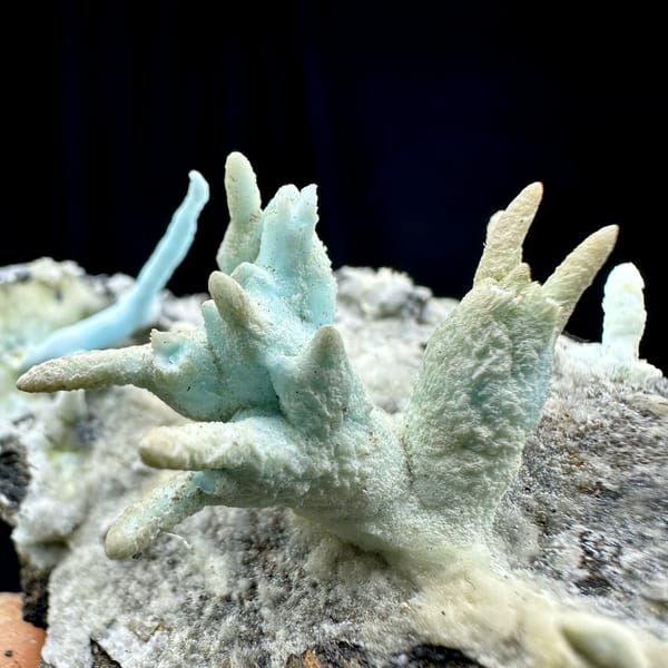 Blue-green stalactitic aragonite fingers on grey rock from Yunnan, China, reverse side