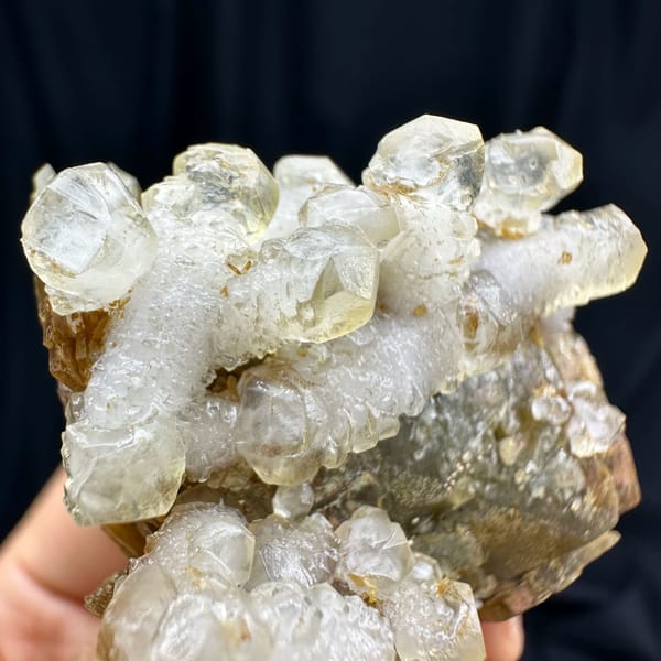 White calcite prisms on golden-brown siderite from Guizhou, China, reverse side