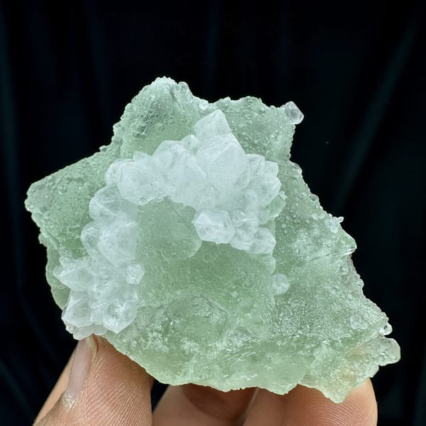 Mint-green fluorite mass with white quartz patch from Guangdong, China, detail of the matrix contact