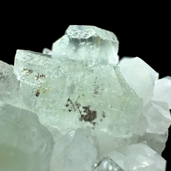 Pale green fluorite cubes with inclusions on white quartz from Guangdong, China, reverse side