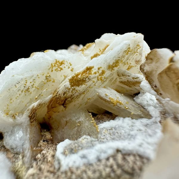 Tan baryte blades on white aragonite with vanadinite from Morocco, reverse side