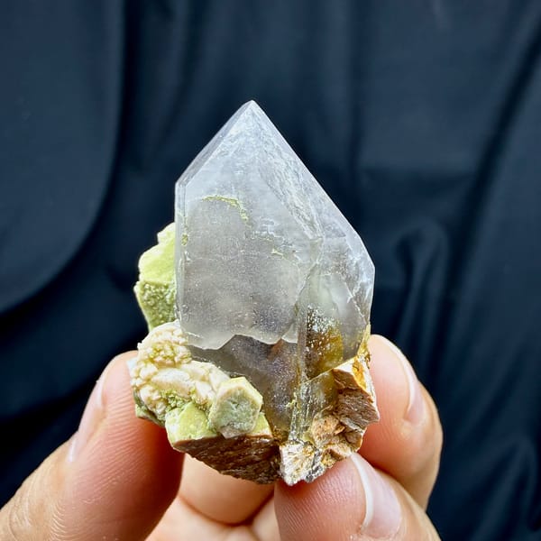 Lavender smoky quartz crystal with lime-green feldspar from Fujian, China, close-up of the crystal faces