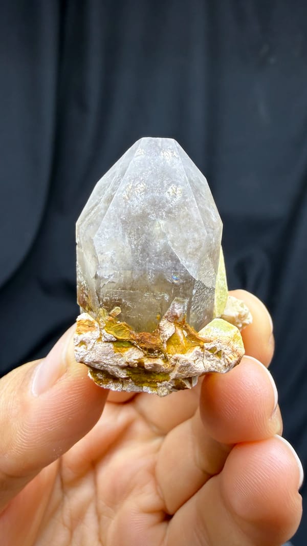Lavender smoky quartz crystal with lime-green feldspar from Fujian, China, top view