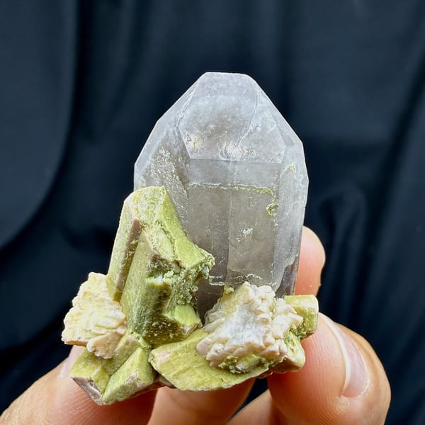 Lavender smoky quartz crystal with lime-green feldspar from Fujian, China, detail of the matrix contact