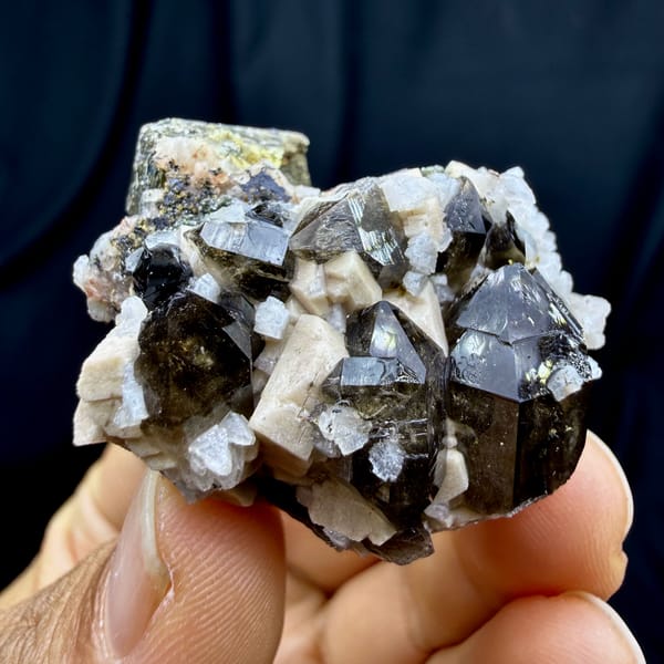 Dark smoky quartz crystals with white feldspar and mica from Yunxiao, Fujian, China, top view