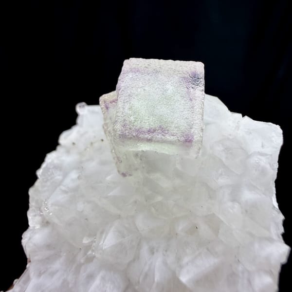 Purple-framed green fluorite cube on white quartz stalk from Zhejiang, China, top view