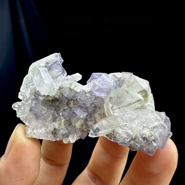 Pale lavender fluorite cubes with white quartz from Yaogangxian Mine, Hunan, China, detail of the matrix contact