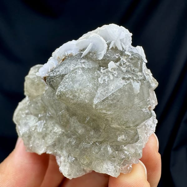 Double-terminated green quartz with calcite plates from Inner Mongolia, China, close-up of the crystal faces