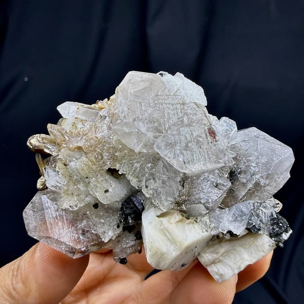 Pale quartz floater with garnet, apophyllite and chabazite from Yunxiao, Fujian, China, detail of the matrix contact