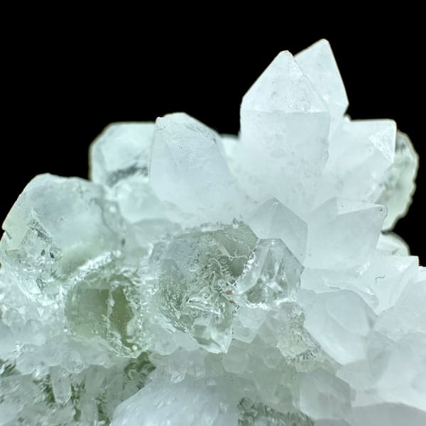 Pale green fluorite cubes in white quartz from Guangdong, China, close-up of the crystal faces