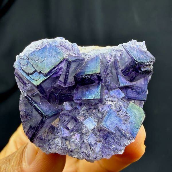 Iridescent purple-framed fluorite cubes with rainbow film from Inner Mongolia, China, reverse side