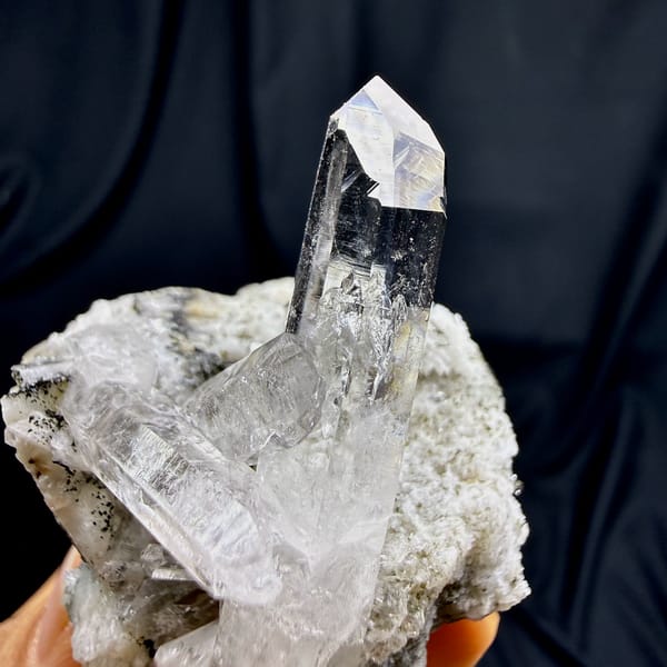 Tall clear quartz prism rising from cream feldspar from Yunxiao, Fujian, China, second angle