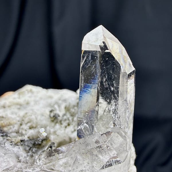 Tall clear quartz prism rising from cream feldspar from Yunxiao, Fujian, China, reverse side