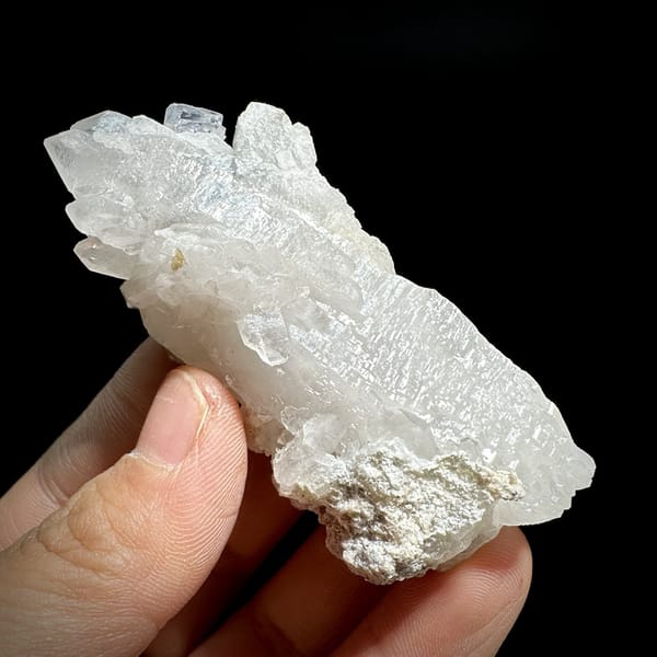 Large frosted quartz crystal with purple-cored fluorite from Yaogangxian Mine, Hunan, China, detail of the matrix contact