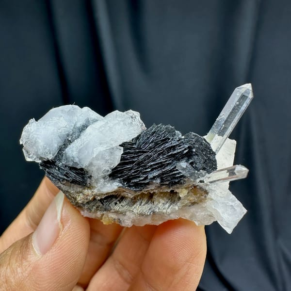 Clear quartz spire on black specular hematite plate from Guangdong, China, second angle