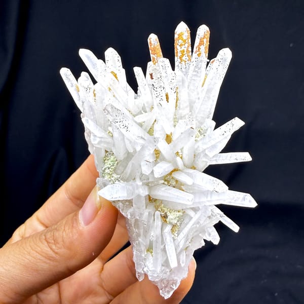Starburst of white quartz needles with rust speckles from Guangdong, China, second angle