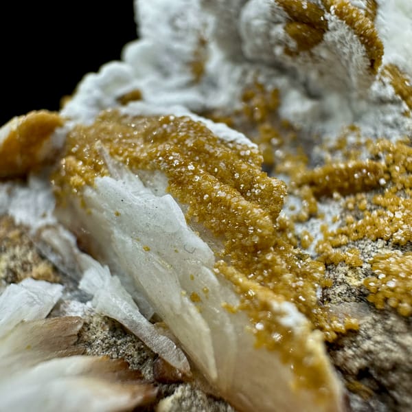 Tan baryte blades with vanadinite druse on white aragonite from Morocco, second angle
