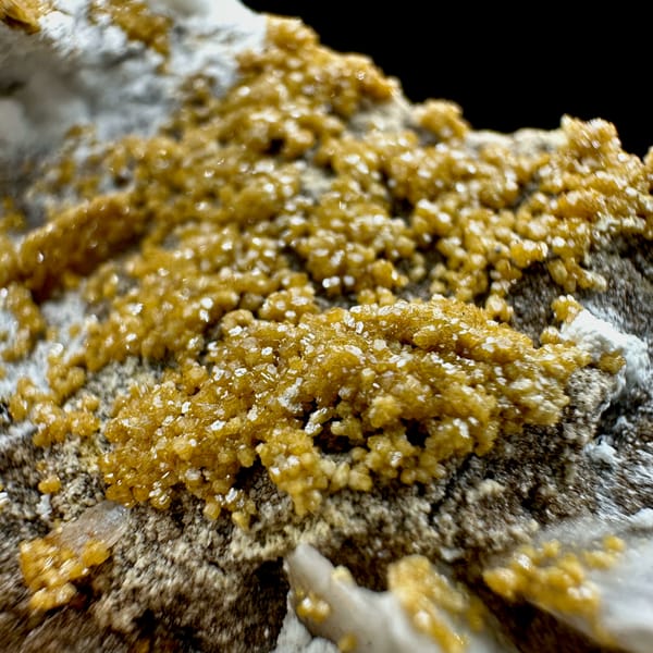 Tan baryte blades with vanadinite druse on white aragonite from Morocco, reverse side