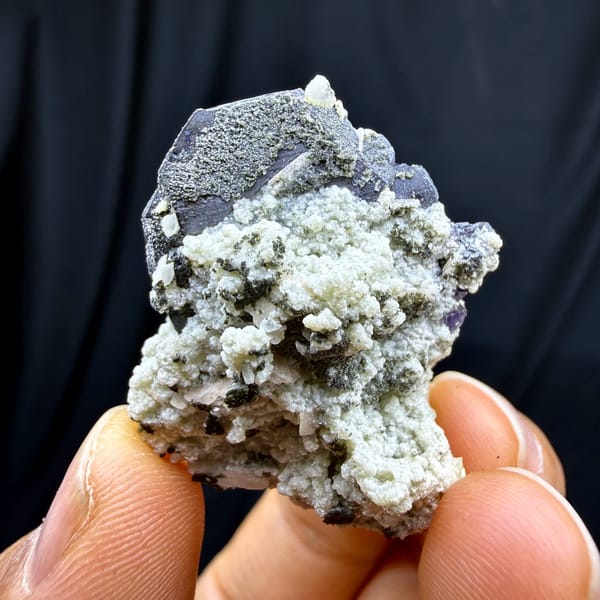 Black wolframite blades with purple fluorite and mica from Yaogangxian Mine, Hunan, China, close-up of the crystal faces