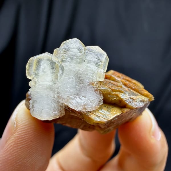 Golden-brown siderite block with pale calcite from Guizhou, China, close-up of the crystal faces