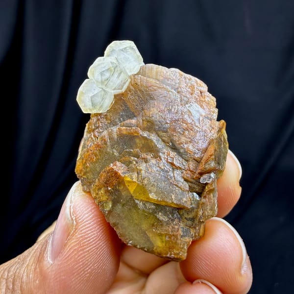Golden-brown siderite block with pale calcite from Guizhou, China, top view