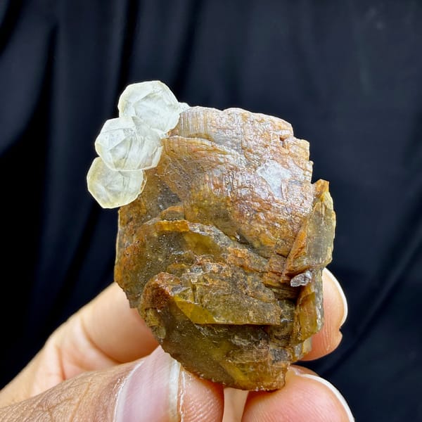 Golden-brown siderite block with pale calcite from Guizhou, China, detail of the matrix contact