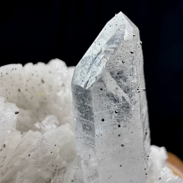 Clear quartz point on cream dolomite with pyrite from Guizhou, China, reverse side