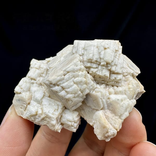 Blocky cream feldspar crystals with small quartz from Yunxiao, Fujian, China, detail of the matrix contact