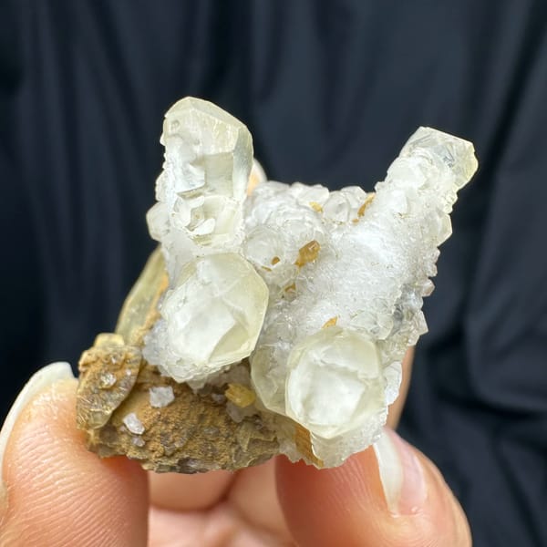 Frosted white calcite prisms on golden siderite block from Guizhou, China, reverse side