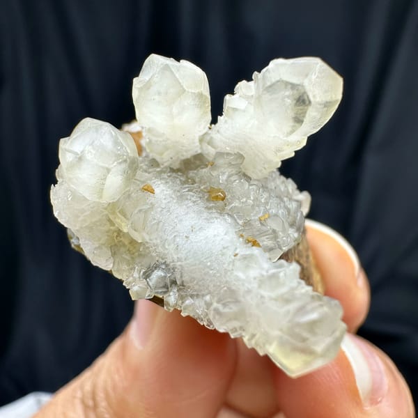 Frosted white calcite prisms on golden siderite block from Guizhou, China, top view