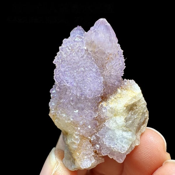 Lilac cactus quartz crystal on small matrix from South Africa, detail of the matrix contact