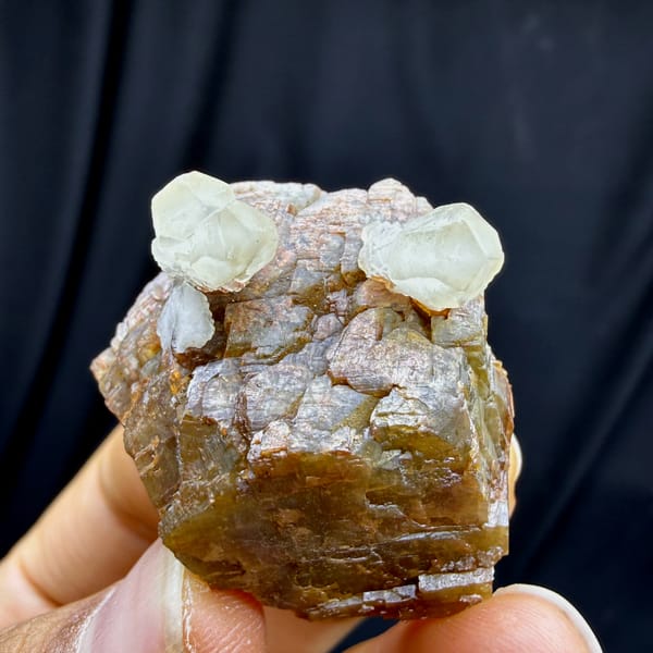 Pale calcite prisms on golden-brown siderite plates from Guizhou, China, second angle