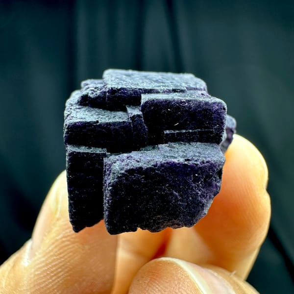 Two black-purple fluorite cubes with matte skin from Inner Mongolia, China, second angle