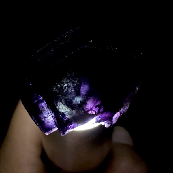 Two black-purple fluorite cubes with matte skin from Inner Mongolia, China, top view