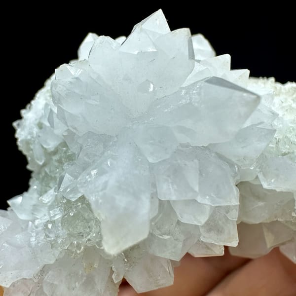 White quartz cluster with clear point and white fluorite from Guangdong, China, close-up of the crystal faces