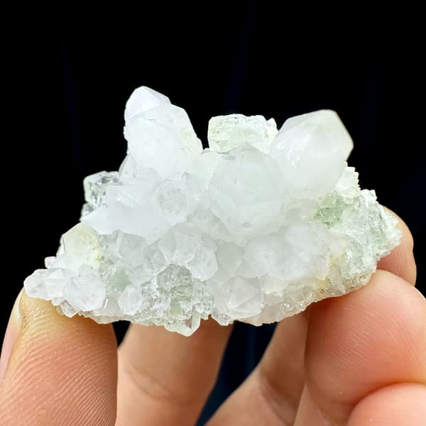 Clear quartz points with pale green fluorite from Guangdong, China, close-up of the crystal faces
