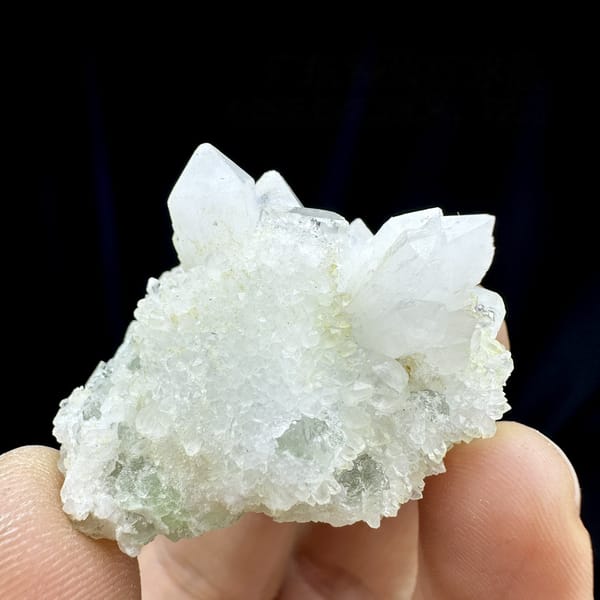 Clear quartz points with pale green fluorite from Guangdong, China, detail of the matrix contact