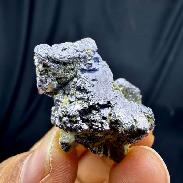 Etched galena cube on green-crusted matrix from Inner Mongolia, China, close-up of the crystal faces