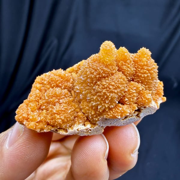 Orange stalactitic calcite mound with sugary skin from Yunnan, China, second angle