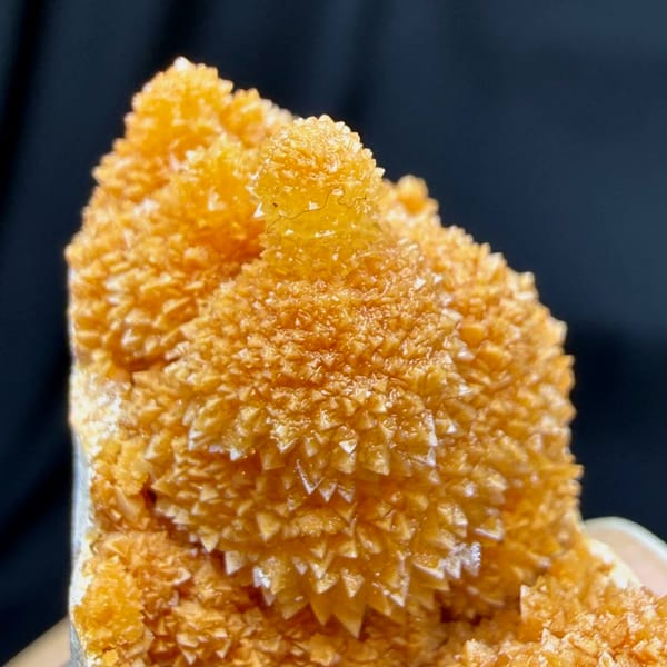 Orange stalactitic calcite mound with sugary skin from Yunnan, China, reverse side