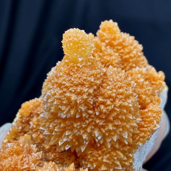Orange stalactitic calcite mound with sugary skin from Yunnan, China, top view