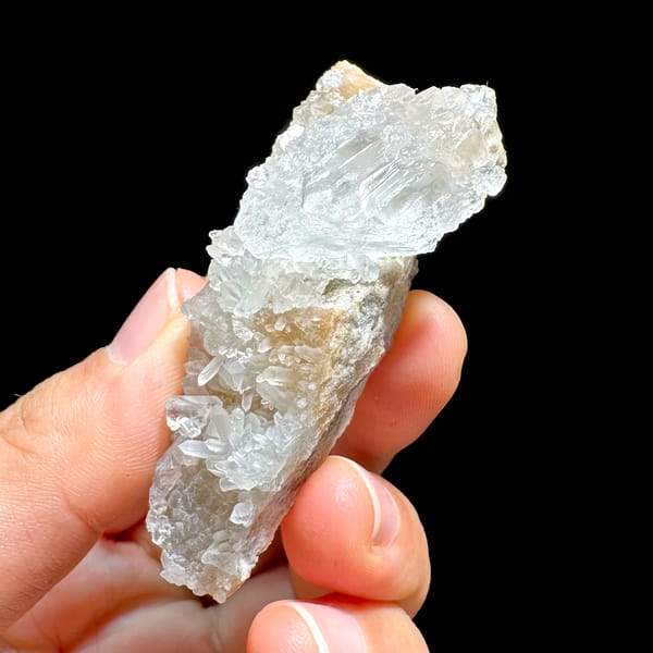 Pale baryte crystal with quartz druse on tan base from Jinkouhe, Sichuan, China, second angle