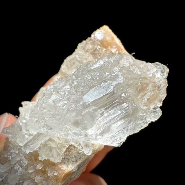 Pale baryte crystal with quartz druse on tan base from Jinkouhe, Sichuan, China, reverse side